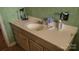Bathroom featuring white vanity and green tile walls, ready for updating at 828 Williams St, Gastonia, NC 28052