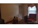 Cozy bedroom with hardwood floors, neutral walls, a window, and closet space at 828 Williams St, Gastonia, NC 28052