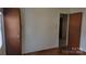 Bedroom with two closets, wood flooring, and bright natural light from window at 828 Williams St, Gastonia, NC 28052