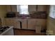 Functional kitchen featuring a double sink and generous counter space, ready for customization at 828 Williams St, Gastonia, NC 28052