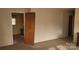 Spacious living room with neutral walls, carpeted flooring, and open doorway to the kitchen at 828 Williams St, Gastonia, NC 28052