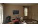 Bright living room with natural light, neutral paint, and visible storage to be organized at 828 Williams St, Gastonia, NC 28052