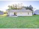 Expansive backyard offers a concrete patio area and ample space for outdoor activities and entertaining at 833 Generation Ln, Clover, SC 29710