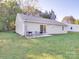 Grassy backyard with a patio and sliding glass door entrance at 833 Generation Ln, Clover, SC 29710