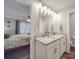 Clean, bright bathroom view from entry featuring double sinks and granite countertops with access to the main bedroom at 833 Generation Ln, Clover, SC 29710