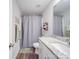 Bathroom with white cabinets, granite countertops, and gray shower curtain at 833 Generation Ln, Clover, SC 29710