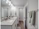 Beautiful bathroom featuring a double sink vanity with granite countertop and modern lighting fixtures at 833 Generation Ln, Clover, SC 29710