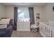 Bedroom room with gray curtains, crib, chair, and white dresser at 833 Generation Ln, Clover, SC 29710