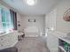 Bedroom room with a crib, dresser, and changing table at 833 Generation Ln, Clover, SC 29710