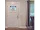 Inviting entryway with a white front door, complemented by a window and stylish interior design elements at 833 Generation Ln, Clover, SC 29710