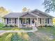 Charming single-story home with inviting front porch, beautiful landscaping, and a welcoming entrance at 833 Generation Ln, Clover, SC 29710