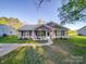 Charming single-story home with inviting front porch, beautiful landscaping, and a welcoming entrance at 833 Generation Ln, Clover, SC 29710