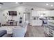 Open-concept living room and kitchen with vaulted ceilings, hardwood floors, and neutral décor at 833 Generation Ln, Clover, SC 29710
