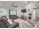 Inviting living room featuring comfortable sofas, a TV, ceiling fan, and stylish decor for relaxation and entertainment at 833 Generation Ln, Clover, SC 29710