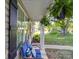 Inviting front porch with blue bench, pillows, and hanging plants at 833 Generation Ln, Clover, SC 29710