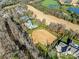 Breathtaking aerial view of sprawling homes nestled along a well-manicured golf course community at 8710 Chewton Glen Dr, Waxhaw, NC 28173