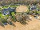 Bird's eye view of golf course homes with lush landscaping, backing onto beautifully maintained fairways at 8710 Chewton Glen Dr, Waxhaw, NC 28173
