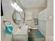 Well-lit bathroom featuring a single sink vanity, oval mirror, and shower with curtain at 903 Lakeview St, Kannapolis, NC 28083