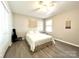 A cozy bedroom with a ceiling fan, decorative wall hangings and guitar at 903 Lakeview St, Kannapolis, NC 28083