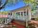 Charming home featuring a welcoming front porch with string lights and a blue front door at 903 Lakeview St, Kannapolis, NC 28083