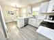 Bright, modern kitchen with white cabinetry, subway tile backsplash, and stainless steel appliances at 903 Lakeview St, Kannapolis, NC 28083