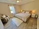 Cozy main bedroom featuring a comfortable king-sized bed, soft lighting, and neutral decor at 903 Lakeview St, Kannapolis, NC 28083