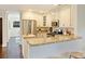 Kitchen featuring stainless steel appliances, granite countertops, and breakfast bar at 908 Academy St, Charlotte, NC 28205