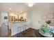 A view of the kitchen and breakfast nook showcasing granite countertops and modern stainless steel appliances at 908 Academy St, Charlotte, NC 28205