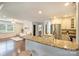 Open floorplan with view from kitchen to living room, featuring granite countertops and stainless appliances at 908 Academy St, Charlotte, NC 28205