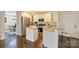 Open kitchen with granite countertops, center island, stainless appliances, and breakfast bar at 908 Academy St, Charlotte, NC 28205
