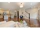 Inviting living room open to kitchen with hardwood floors and staircase at 908 Academy St, Charlotte, NC 28205