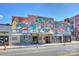 Charming neighborhood movie theater with colorful signage and posters under a clear blue sky at 908 Academy St, Charlotte, NC 28205