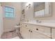 Comfortable bathroom featuring white vanity, framed mirror and a tub with shower at 9101 Oak Bluff Ct, Marvin, NC 28173