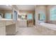 Bright bathroom features double vanity, soaking tub and separate shower at 9101 Oak Bluff Ct, Marvin, NC 28173