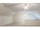 Large bonus room with neutral walls, carpeted floors and two ceiling fans at 9101 Oak Bluff Ct, Marvin, NC 28173