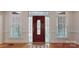 Elegant front entrance features a stained-glass door, sidelights, and transom windows for a grand and welcoming foyer at 9101 Oak Bluff Ct, Marvin, NC 28173