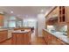 Open kitchen with wooden cabinets, stainless steel appliances, and island at 9101 Oak Bluff Ct, Marvin, NC 28173