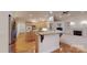 Bright kitchen boasts wooden cabinets, stainless steel appliances, and an island with a countertop at 9101 Oak Bluff Ct, Marvin, NC 28173