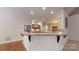 Well-appointed kitchen with wood cabinets, stainless steel appliances, and a convenient breakfast bar, great for casual dining at 9101 Oak Bluff Ct, Marvin, NC 28173