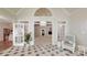 Sunroom features tile floors and French doors leading to the home's interior at 9101 Oak Bluff Ct, Marvin, NC 28173