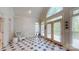 Sunroom with patterned tile flooring, vaulted ceilings, and multiple windows at 9101 Oak Bluff Ct, Marvin, NC 28173