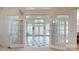Elegant sunroom with tiled floor, bright windows and access to back yard at 9101 Oak Bluff Ct, Marvin, NC 28173