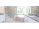 Modern bathroom with soaking tub, glass shower, and granite countertops at Tbd Boomer Ct # 1, Statesville, NC 28677