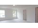 Neutral bedroom with plush carpet, two windows, and white trim at Tbd Boomer Ct # 1, Statesville, NC 28677