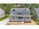Charming blue two-story home with stone accents and a welcoming front porch at Tbd Boomer Ct # 1, Statesville, NC 28677