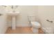 Bathroom featuring a pedestal sink and ceramic tile floors at Tbd Boomer Ct # 1, Statesville, NC 28677