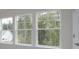 Bright windows offer beautiful views of the surrounding wooded landscape at Tbd Boomer Ct # 1, Statesville, NC 28677