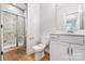 Contemporary bathroom with tiled shower, modern fixtures, and wood-look flooring at Tbd Boomer Ct # 2, Statesville, NC 28677