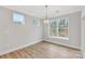 Bright dining room with large windows and modern lighting at Tbd Boomer Ct # 2, Statesville, NC 28677