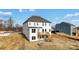 Backyard view of two-story home featuring deck, patio, and fire pit at Tbd Boomer Ct # 3, Statesville, NC 28677